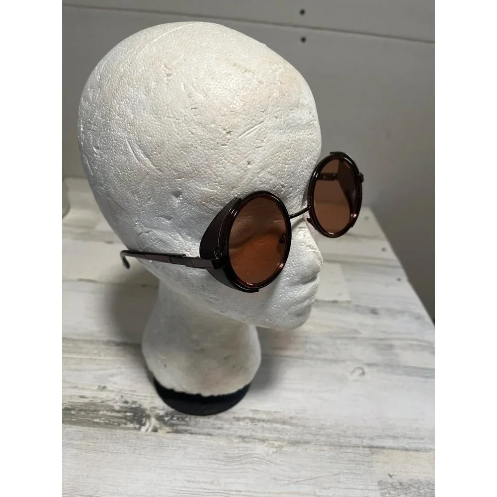 Glasses round amber tinted with black case
